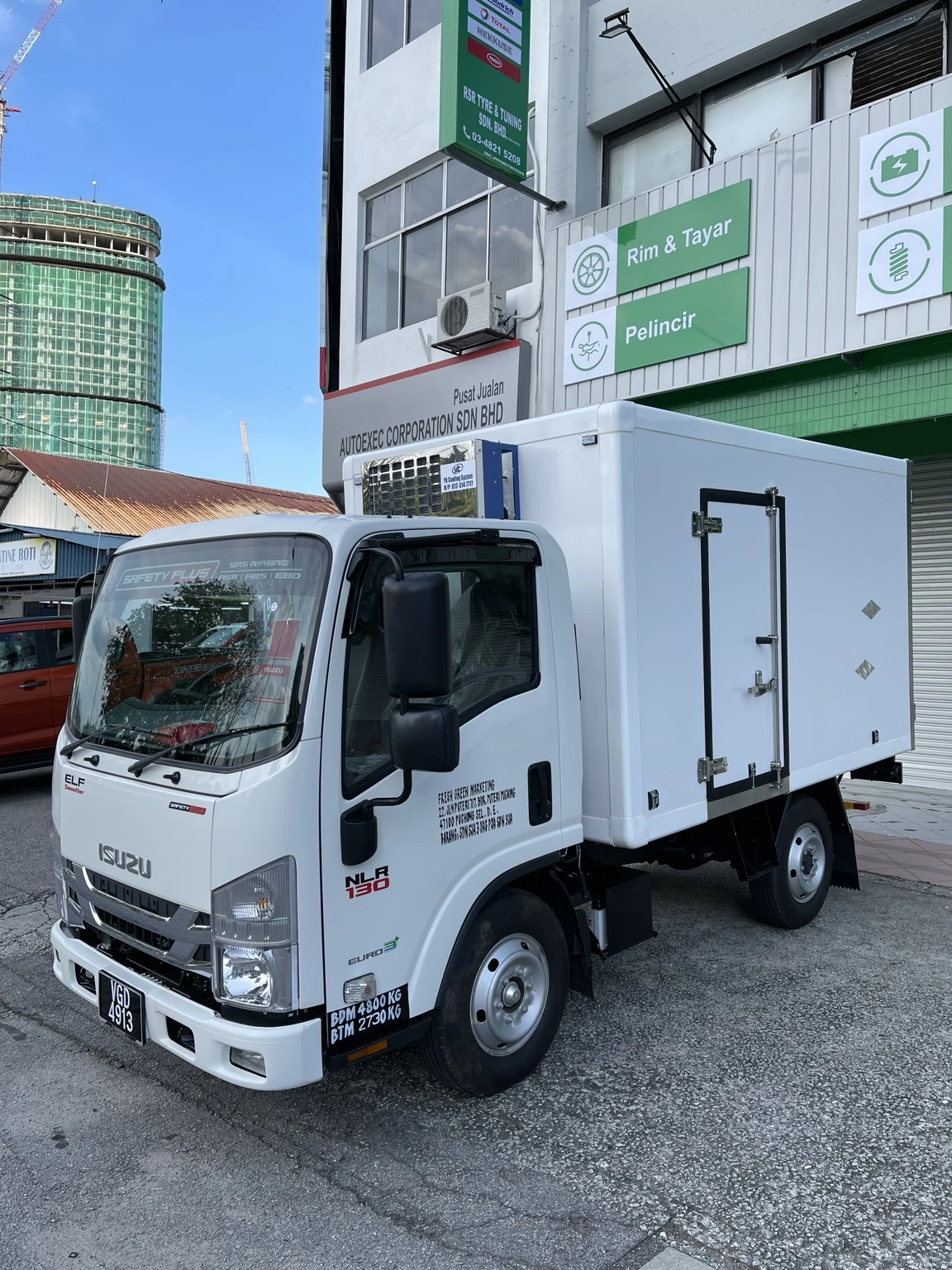 Isuzu lorry with a refrigerated freezer or chiller body